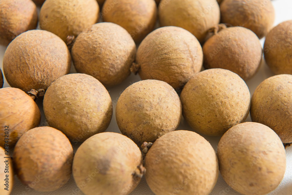 Longan arranged in a heart shape on a white background Longan arranged in a heart shape on a white background