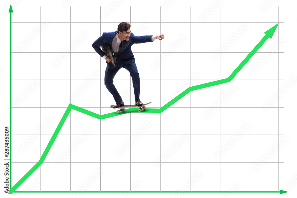 Businessman riding skateboard on financial graph Businessman riding skateboard on financial graph