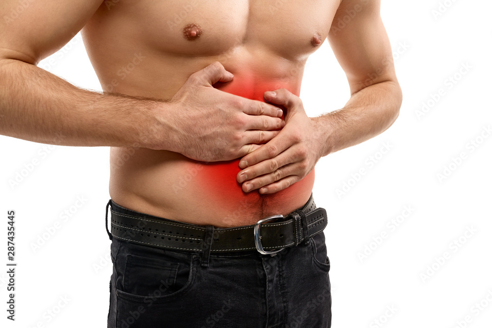 Naklejka premium Shirtless man having stomach ache