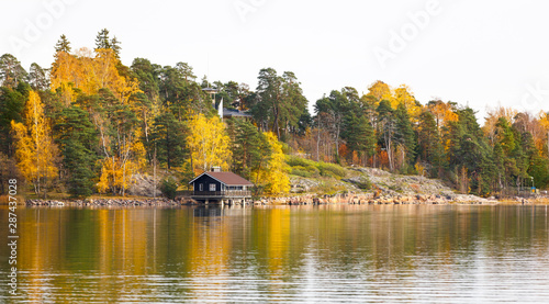 Colorful autumn forest beside a lake