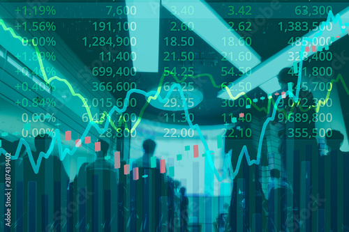 Blurred of Stock Trader or business men are Analyzing stock graph chart and stock market data on monitor, asia stock trader Analysis concept