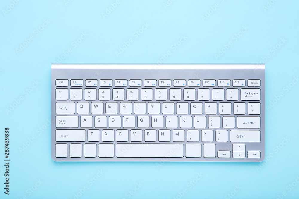 Computer keyboard on blue background Computer keyboard on blue background
