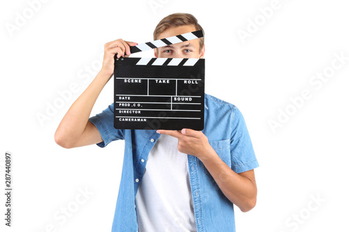 Young man with clapper board isolated on white background