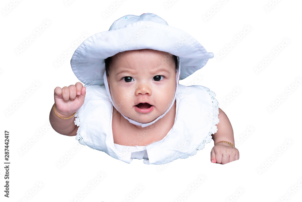 Southeast Asian baby girl is wearing white hat and shirt. South East Asian newborn is 4 months old. New born is concentrate. Infant is crawling. Kid is focus. - Isolate photo with white background. Southeast Asian baby girl is wearing white hat and shirt. South East Asian newborn is 4 months old. New born is concentrate. Infant is crawling. Kid is focus. - Isolate photo with white background.