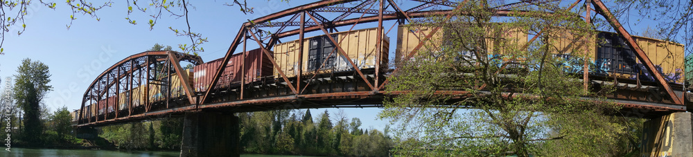 Cargo train passing across a trestle in Eugene, Oregon.
