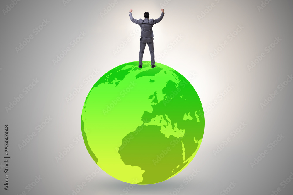 Businessman on top of the world Businessman on top of the world