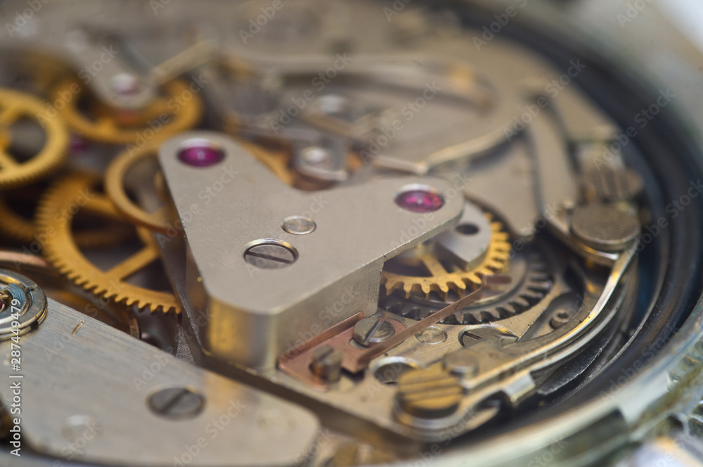 Clockwork, gears in an old watch. Teamwork concept, idea, technology, eternity, business. Macro Clockwork, gears in an old watch. Teamwork concept, idea, technology, eternity, business. Macro