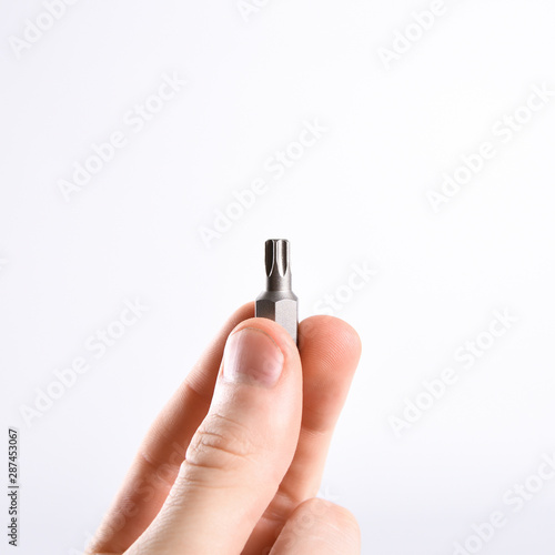  Set of screwdriver bits in the man's hand (torx heads)