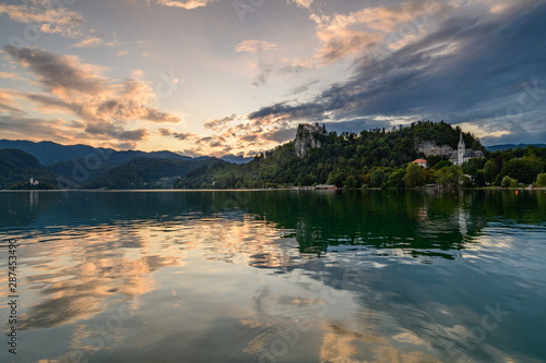 Evening (golden hour) landscape on Lake Bled with reflection and beautiful sky. © a_mikhail
