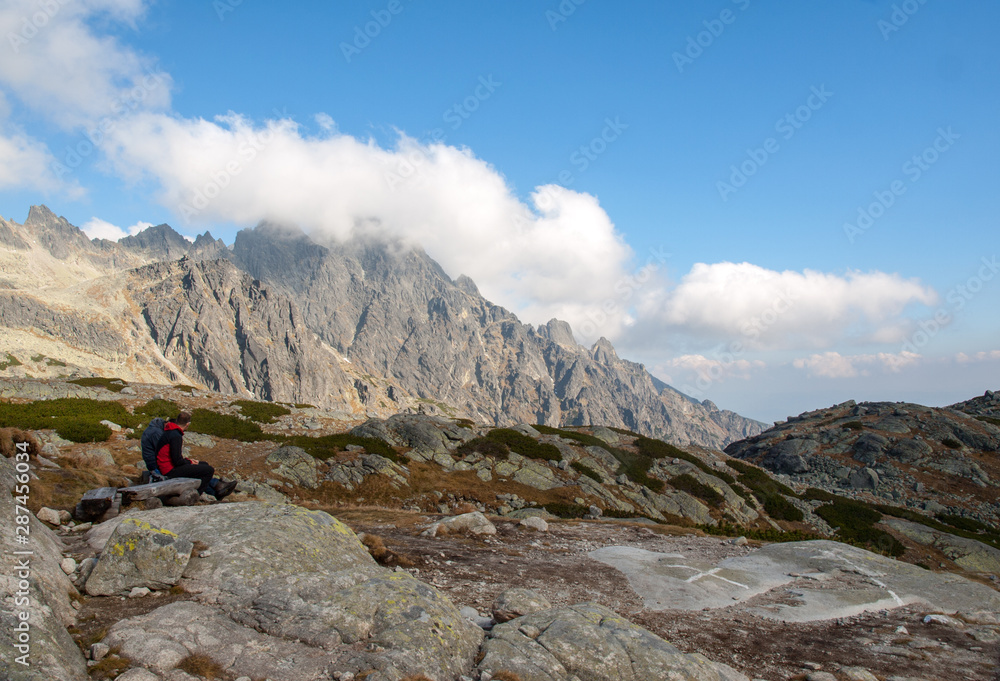 Vysoke Tatry, Slovakia - October 10, 2018: Hikers on trail at Great Cold Valley,  Vysoke Tatry (High Tatras), Slovakia. The Great Cold Valley is 7 km long valley, very attractive for tourists
