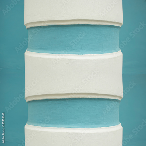 Abstract classic architecture fragment, white columns with blue stripes