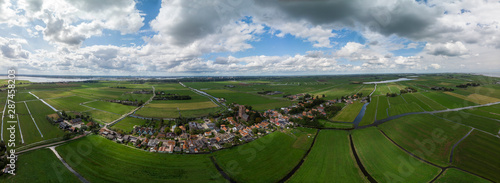 Canvas Print Dramatic aerial panoramic view of the agrarian green pasture fields with its irr