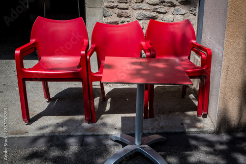 Three red chairs and table