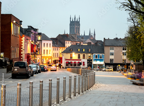 Cars parked in a row at Kilkennys town and castles view in  the background, Kilkenny, Ireland.