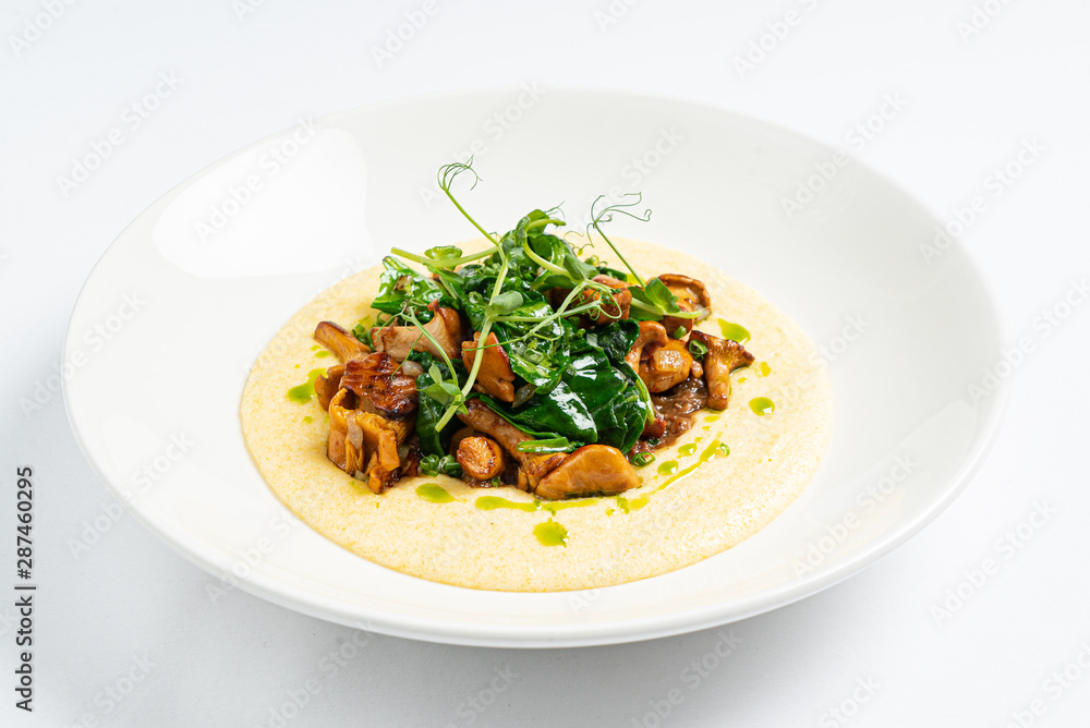 polenta with chanterelles on the white plate
