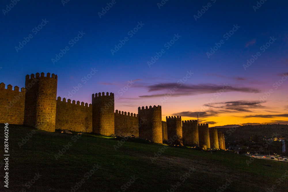 Beautiful sunset with bright colors on the UNESCO heritage wall of Avila. Spain