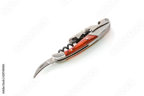 Sommelier knife with corkscrew and bottle opener with open bottle foil pruning blade, professionsl waiter knife, close up. photo