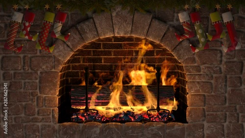 Christmas fireplace with Yule Log. Burning Yule Log in fireplace decorated with christmas stockings. Seamless looping.