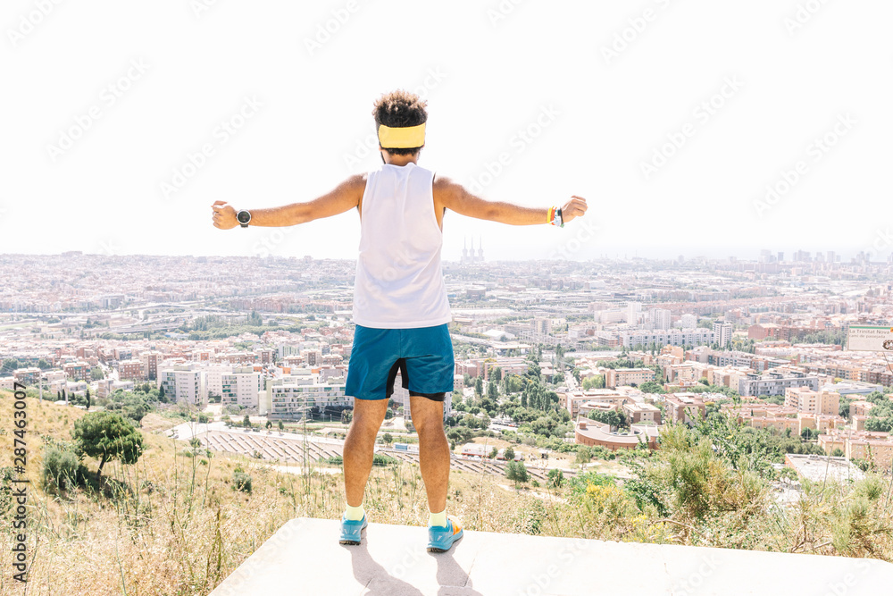 Athletic runner man looking at the city views