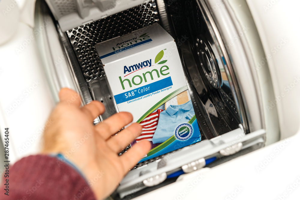 PARIS, FRANCE JAN 23, 2018 Man pointing to new box of Amway Home