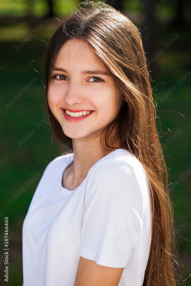 Young beautiful blonde girl with bare shoulders