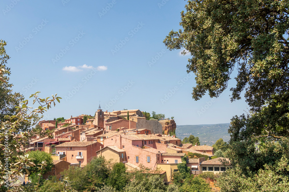 The small village of Roussillon. Landscape with houses in historic ocher town Roussillon, Provence, France