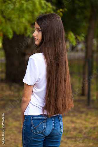 Female brunette hair, rear view, summer park