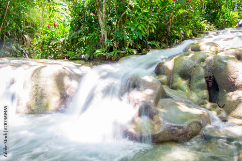 Flowing river falls over limeston photo