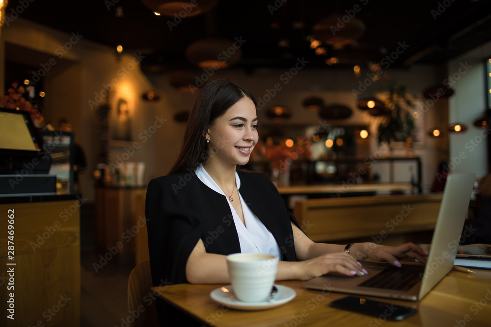 Happy smiling business woman having online conference via laptop computer, sitting in restaurant. Cheerful female employer having video call via notebook. Webinar via netbook gadget Happy smiling business woman having online conference via laptop computer, sitting in restaurant. Cheerful female employer having video call via notebook. Webinar via netbook gadget