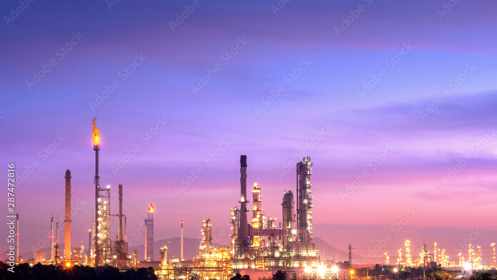 Close-up view Oil and gas industrial refinery zone,Detail of equipment oil pipeline steel with valve from large oil storage tank at cloudy sky. -image Close-up view Oil and gas industrial refinery zone,Detail of equipment oil pipeline steel with valve from large oil storage tank at cloudy sky. -image