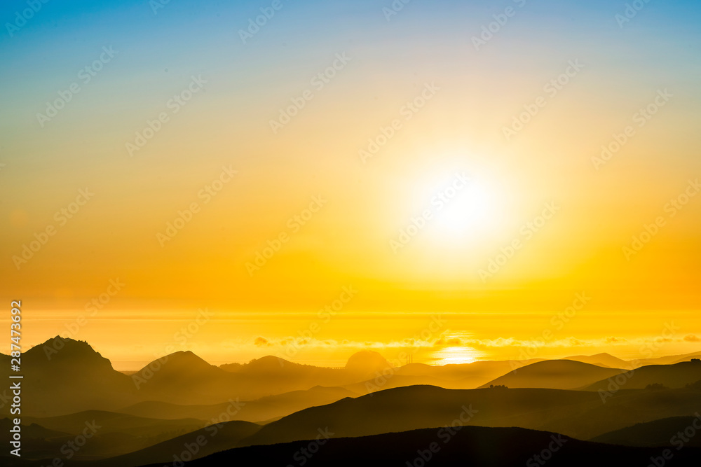Sun over Ocean, Mountains, Afternoon