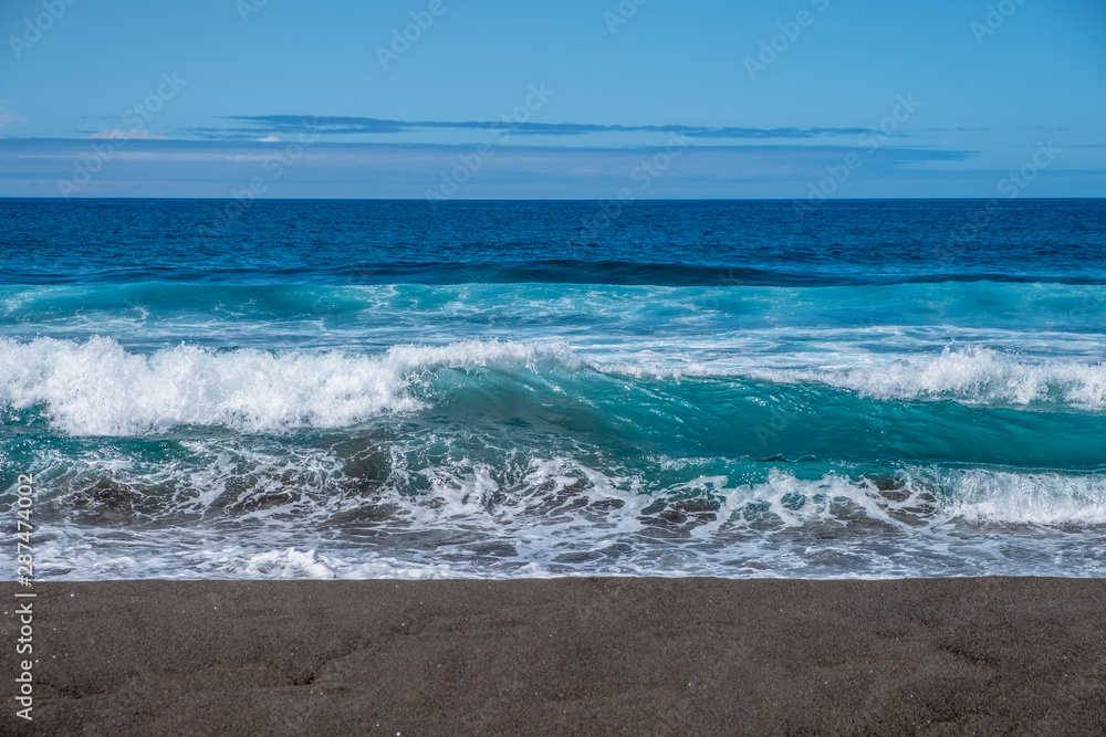 Foamy Atlantic ocean on black sand Beach of Santa Barbara, Sao Miguel Island, Azores, Portugal Foamy Atlantic ocean on black sand Beach of Santa Barbara, Sao Miguel Island, Azores, Portugal