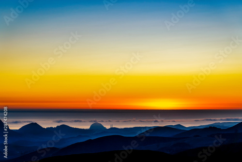 Sunset over Ocean  Silhouetted Hills