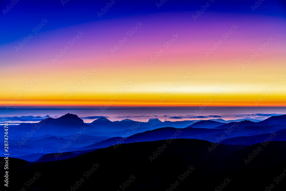Sunset over Ocean, Hills, Mountains