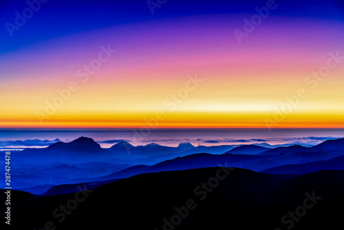Sunset over Ocean, Hills, Mountains © Mark