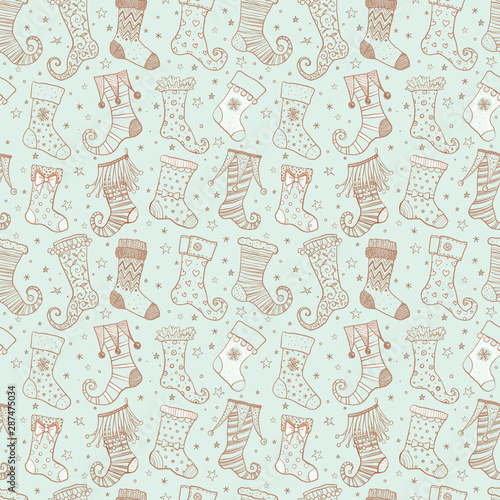 Seamless background with christmas gift socks on light mint background. Can be used for wallpaper, pattern fills, textile, web page background, surface textures.