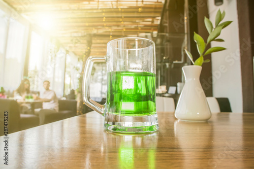 St. Patrick's day background. Beer on wooden table in cafe