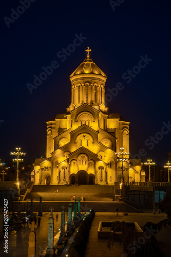 Famous Orthodox Holy Trinitiy Sameba church illuminated with golden light.