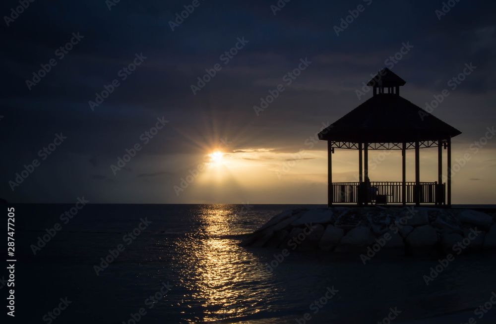 Silhouette of gazebo with colorful sunset Silhouette of gazebo with colorful sunset