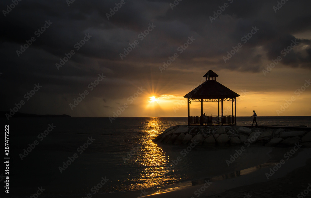 Silhouette of gazebo with colorful sunset
