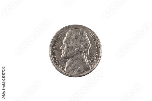 An American five cent nickel, close up in macro, against a clean, white background