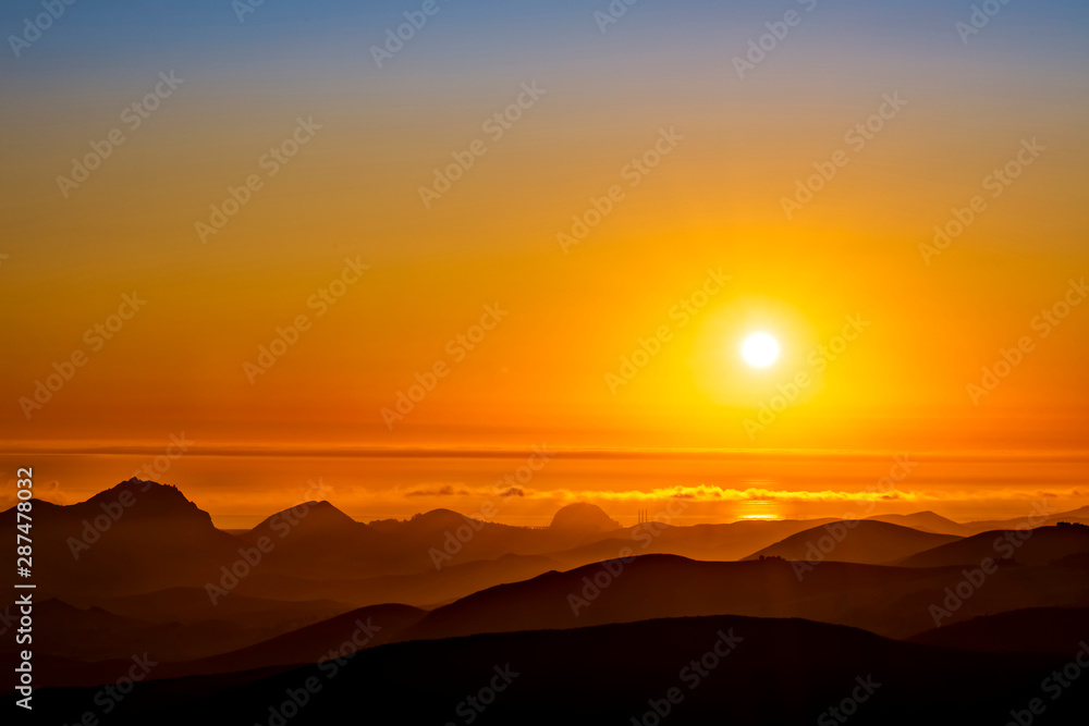 Sunset in the Mountains, orange sun