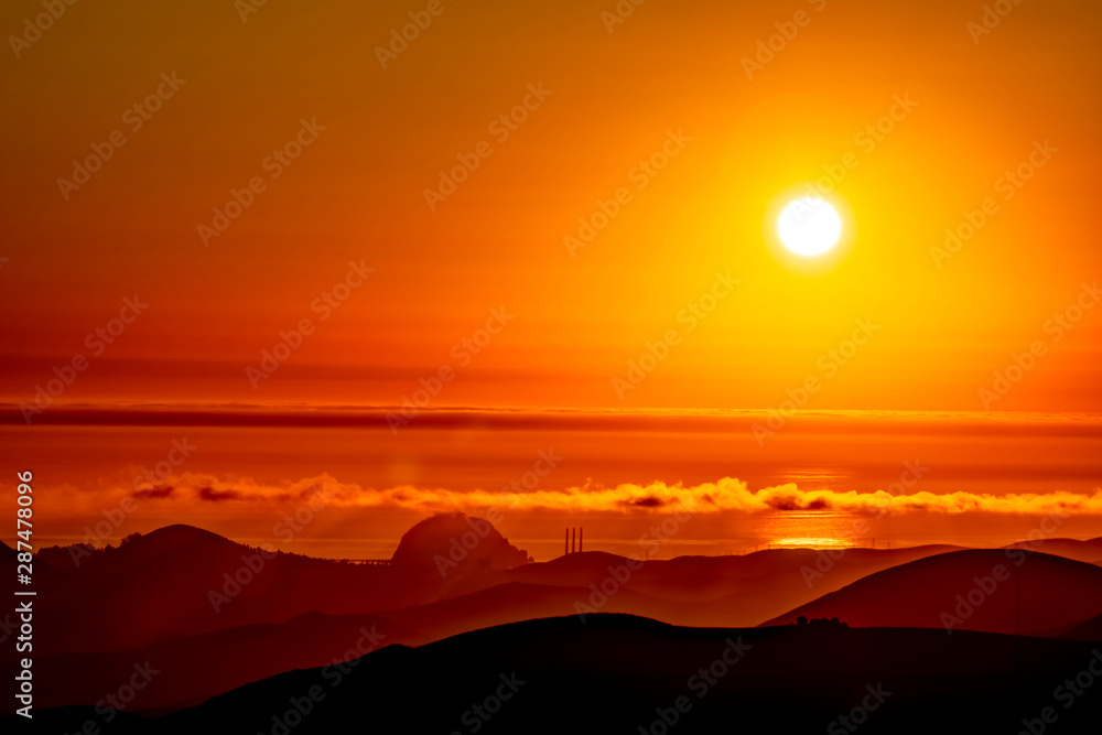 Afternoon Sunset over Ocean, Mountains, Hills