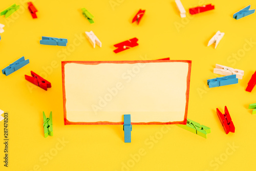 Colored clothespin papers empty reminder yellow floor background office