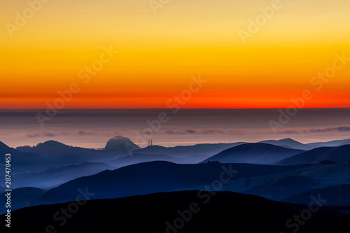 Wallpaper Mural Setting Sun, Ocean, Mountains, Silhouette  Torontodigital.ca