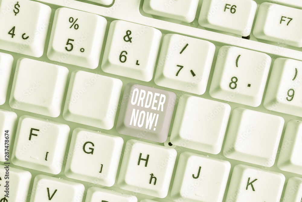 Word writing text Order Now. Business photo showcasing confirmed request by one party to another to buy sell White pc keyboard with empty note paper above white background key copy space
