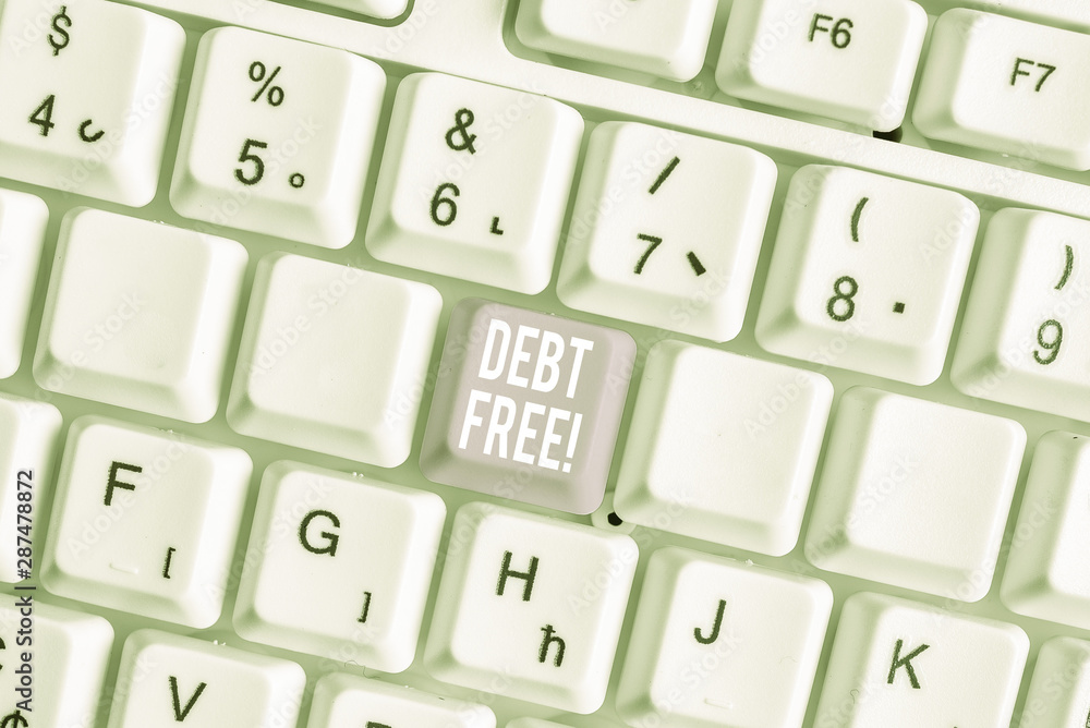 Word writing text Debt Free. Business photo showcasing does not owning any money or things to any individual or companies White pc keyboard with empty note paper above white background key copy space Word writing text Debt Free. Business photo showcasing does not owning any money or things to any individual or companies White pc keyboard with empty note paper above white background key copy space