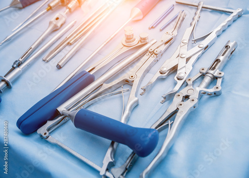 Sterilized surgical instruments and tools on the blue table. A spine surgery equipment