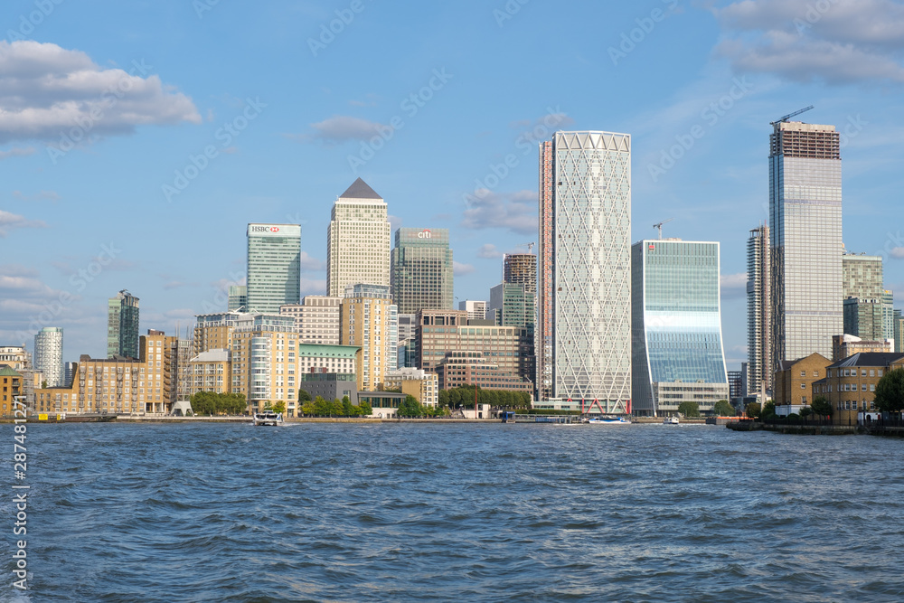 The Camary Wharf Financial Center in London as seen from the river Thames