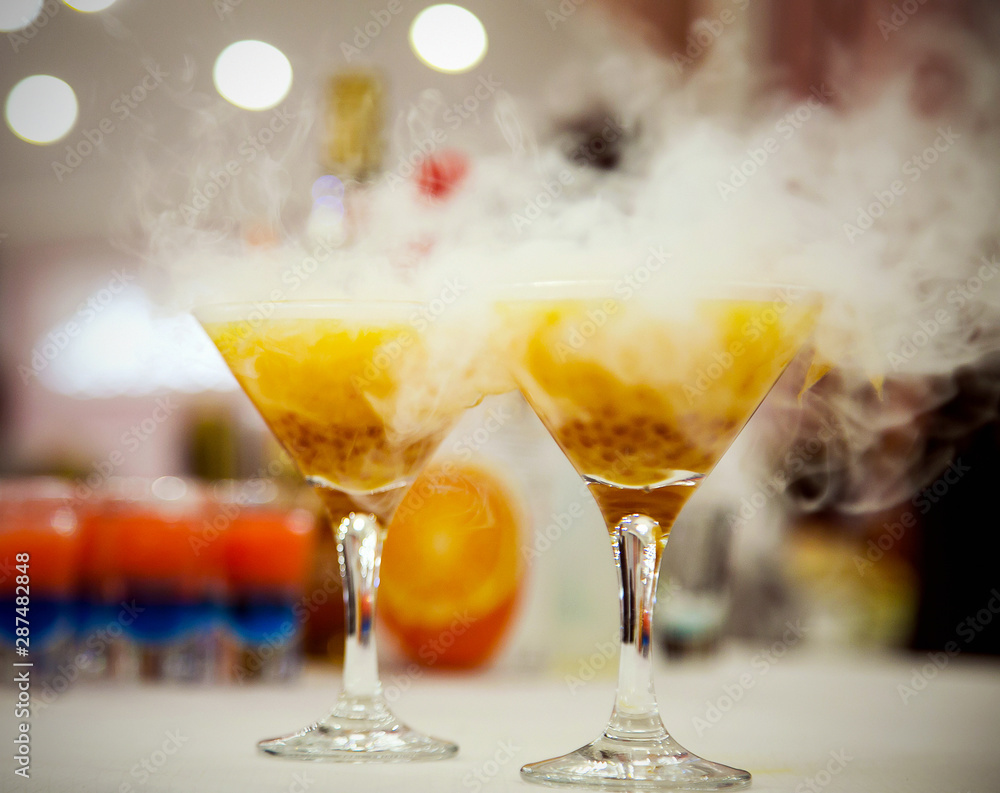 cocktail with liquid nitrogen, yellow Martini